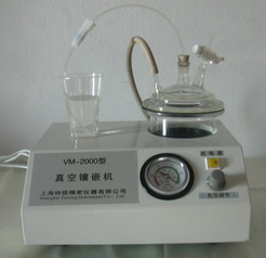 Vacuum inlay machine